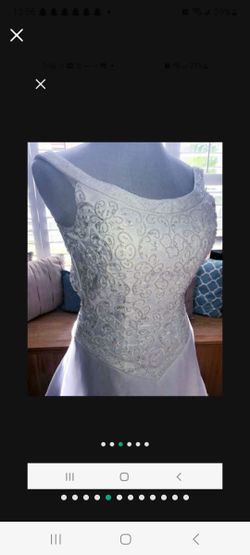 Michelangelo Wedding Gown W/Tags Sz 4. Beautifully Beaded A Line Scoop Strap Neck Line With sheer overlay on back of dress and train with gorgeous han