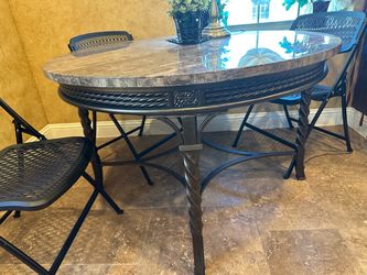 Gorgeous round marble table with metal scroll legs Gorgeous round marble table with metal scroll legs