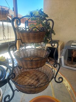 Iron basket for indoors or outdoors.