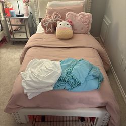 2 beige twin size beds