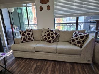 7-Seat Beige Fabric Sofa with Throw Pillows. Cross sectional couch.