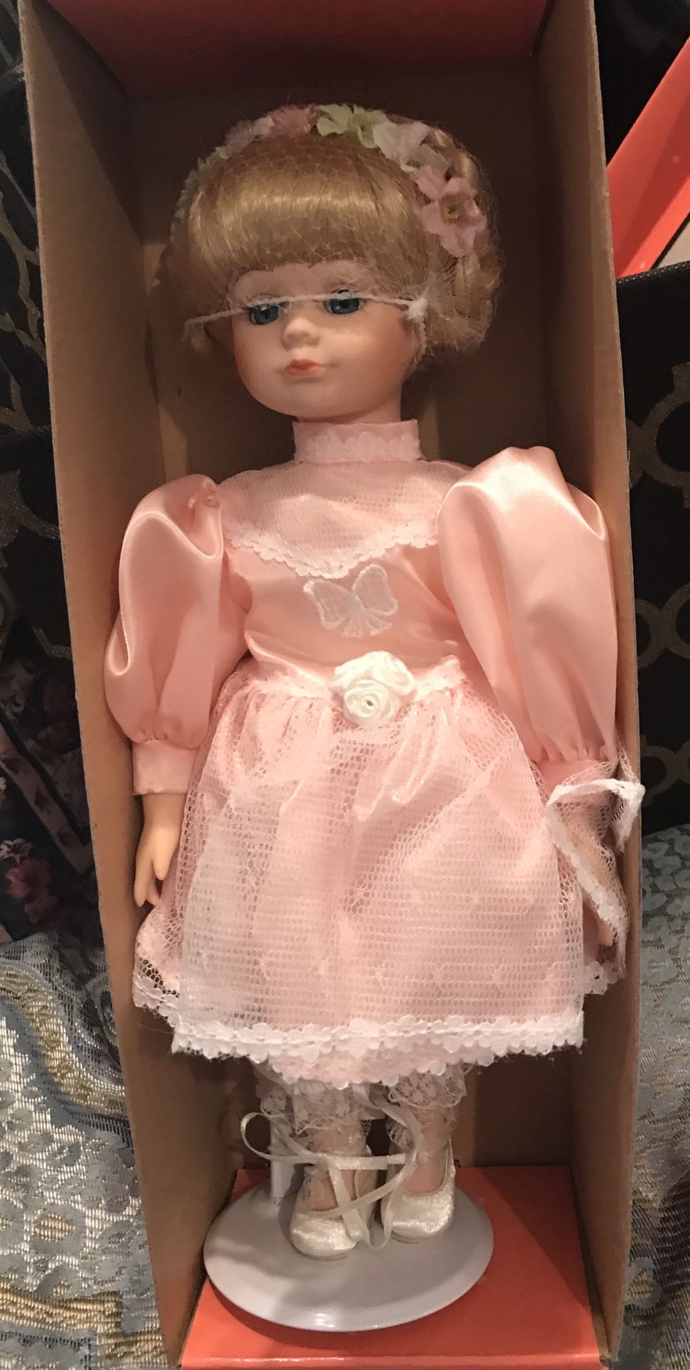 Porcelain collectible doll In excellent condition still in original box.