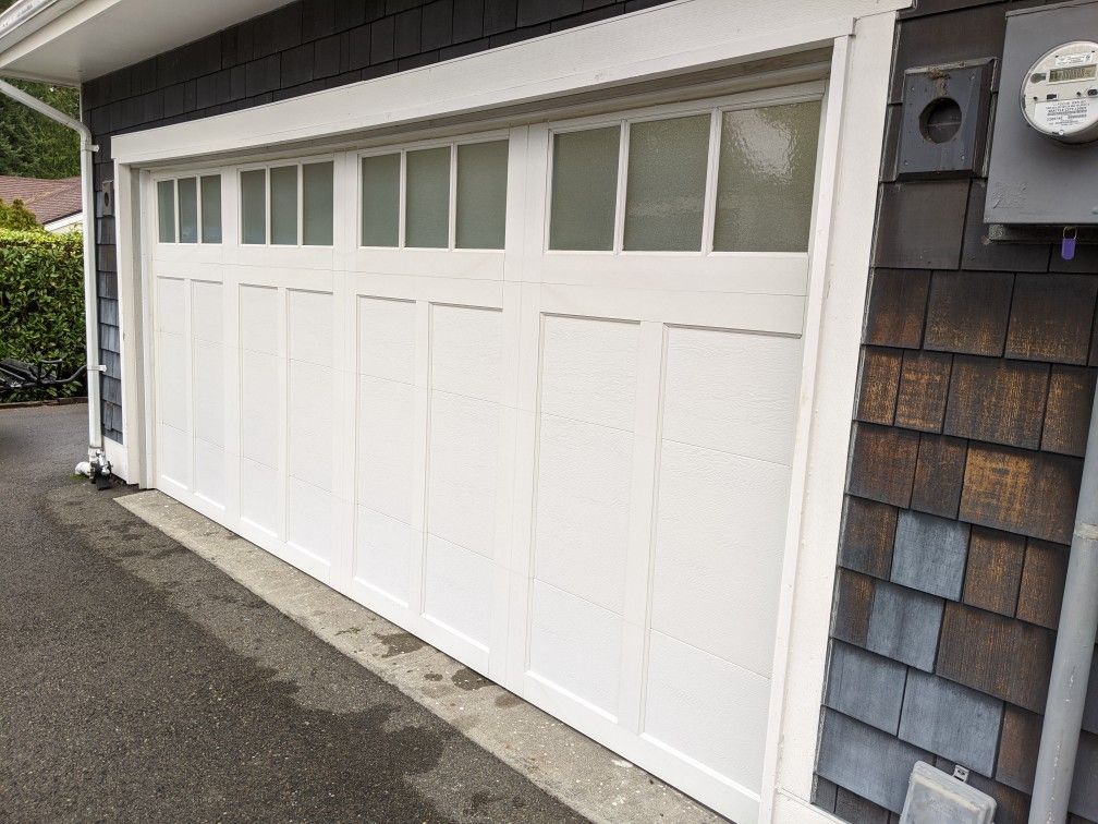 Used garage door fits 16' wide x 7' tall opening