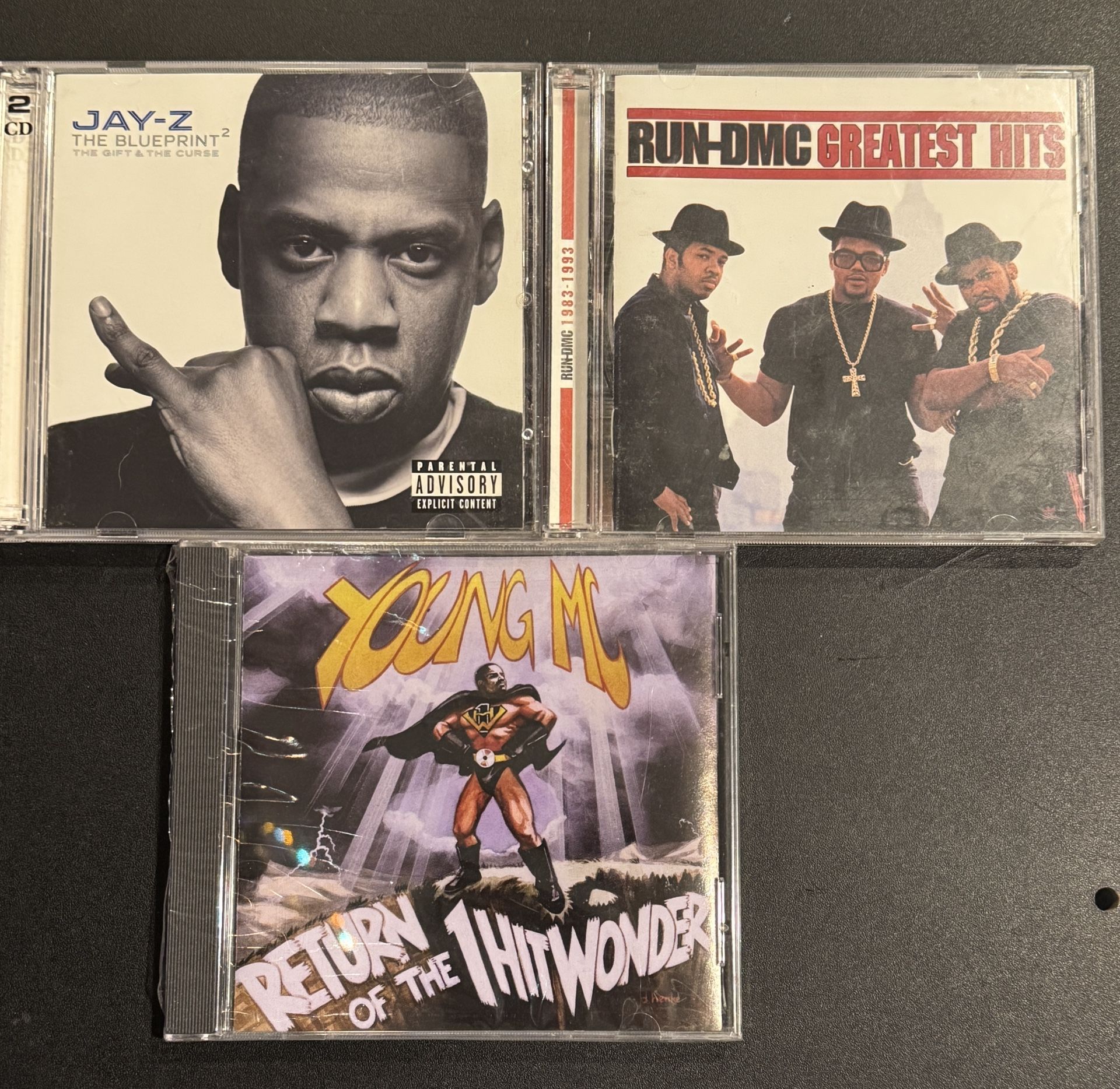 CD Lot: includes Run DMC, Jay Z, & Young MC.