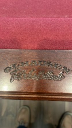Pool table with pool sticks