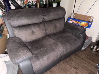Gray reclining love seat and couch