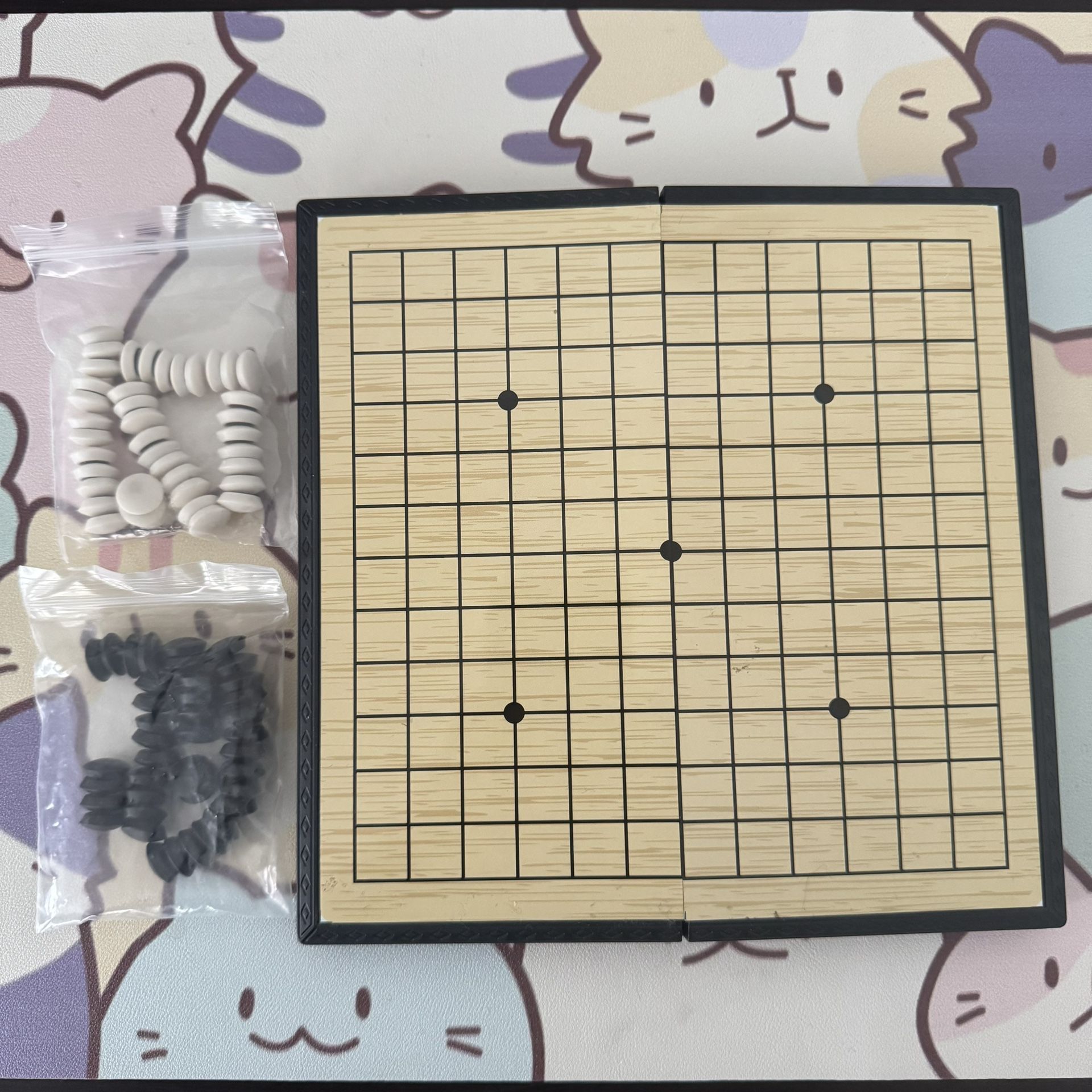 Magnetic foldable portable game board