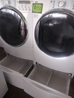 Kenmore front load washer and dryer set with pedestals in excellent conditions