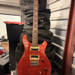 PRs SE Electric Guitar With Case.