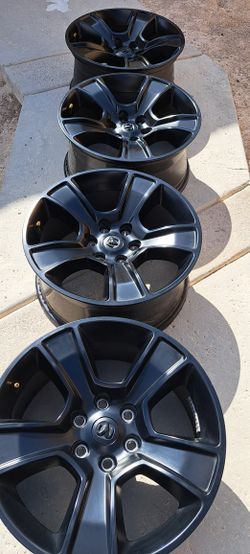 (4) 20 in OEM wheels for a Dodge Ram 1500, specifically from the 2019-2023 models. 6 lugs