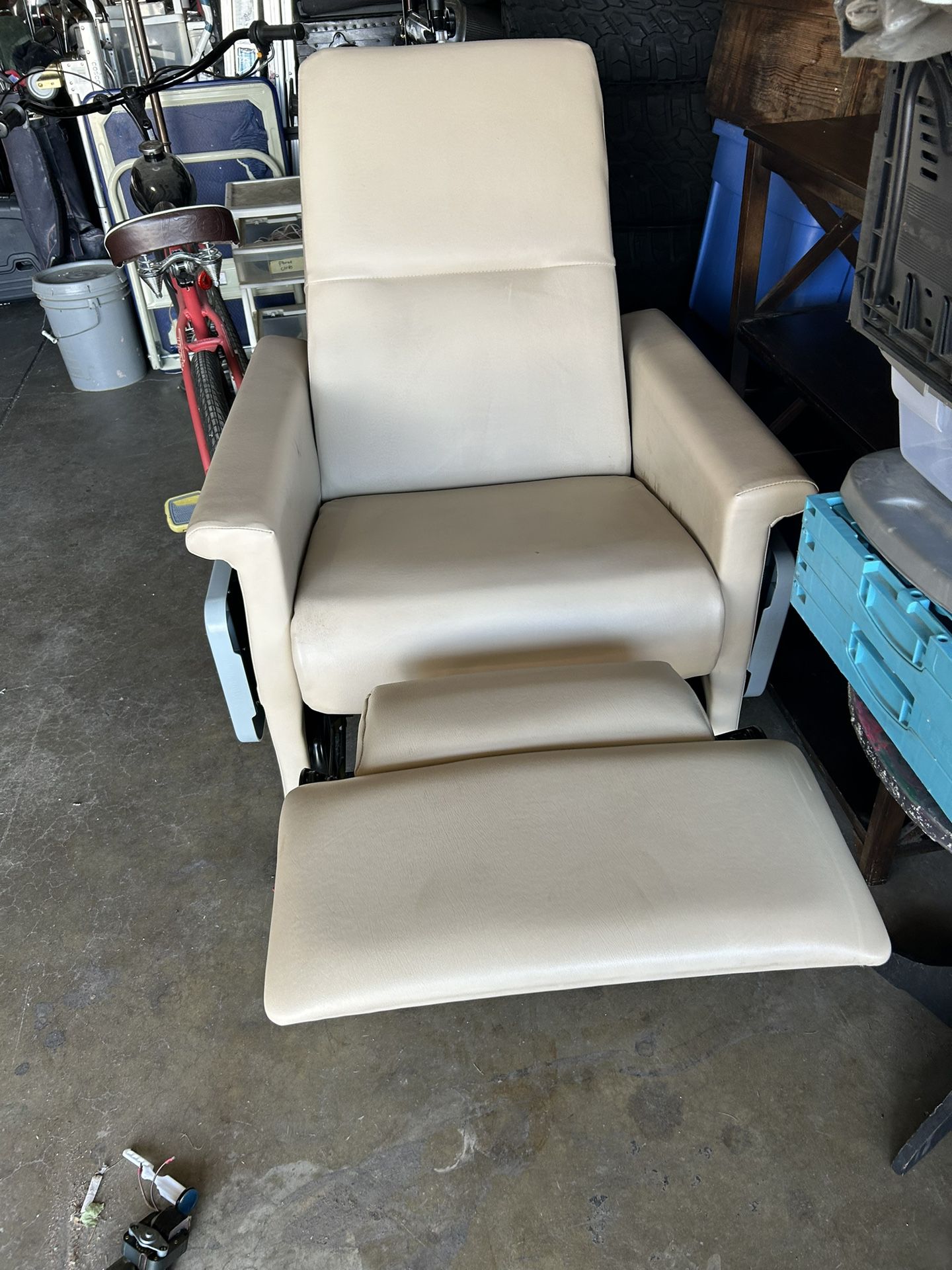 Recliner on casters with push bar and side tables