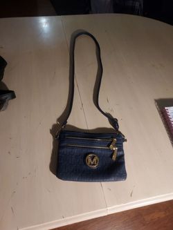 Small blue purse with the letter M in front side
