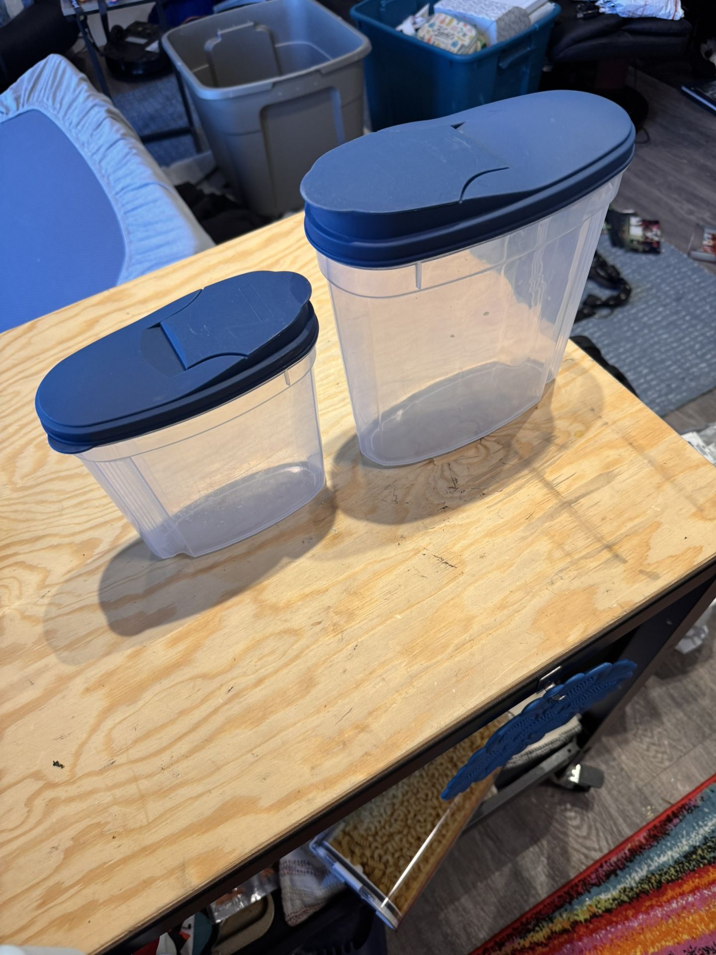 Two Different Sized Cereal Containers With Pop Tops