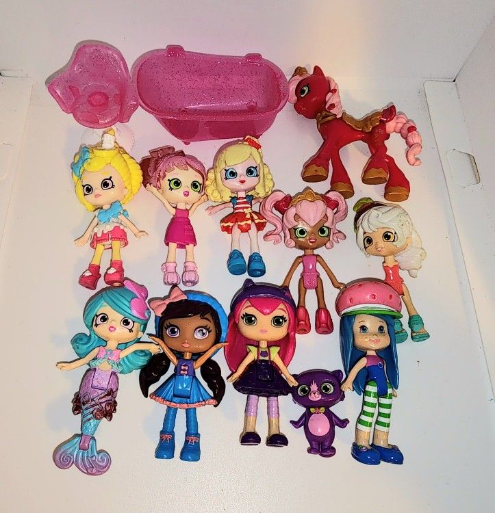 lot of Shopkins Shoppies, Little Charmers, and Strawberry Shortcake Blueberry Muffin