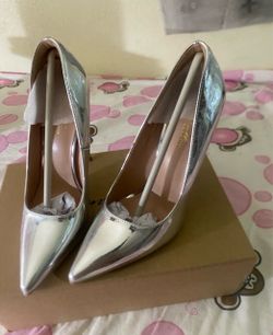 Silver high heels $20 never used size 7.