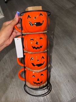 Halloween pumpkin mug stack