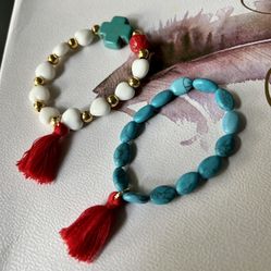 Turquoise And White Stone Bracelets With A Red Tassels