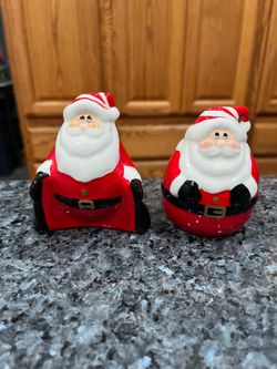 Vintage Santa Rolly Polly Pair of Salt and Pepper Shakers.  Size tallest approximately 3 1/2 inches tall.  Preowned .  No white spots the lighting is 