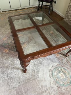 Brand name Ethan Allen Coffee Table with glass surface panels on fine wood. Ethan Allen coffee table with glass sectional surface and beautiful wood