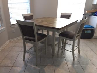 Brand new counter height dining table with 4 chairs