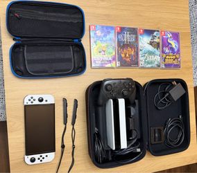 Nintendo switch OLED with games and accessories