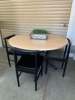Heavy modern table and 4 black chairs