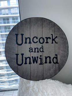 “Uncork and Unwind” sign