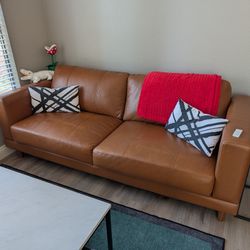 Tan faux leather sofa
