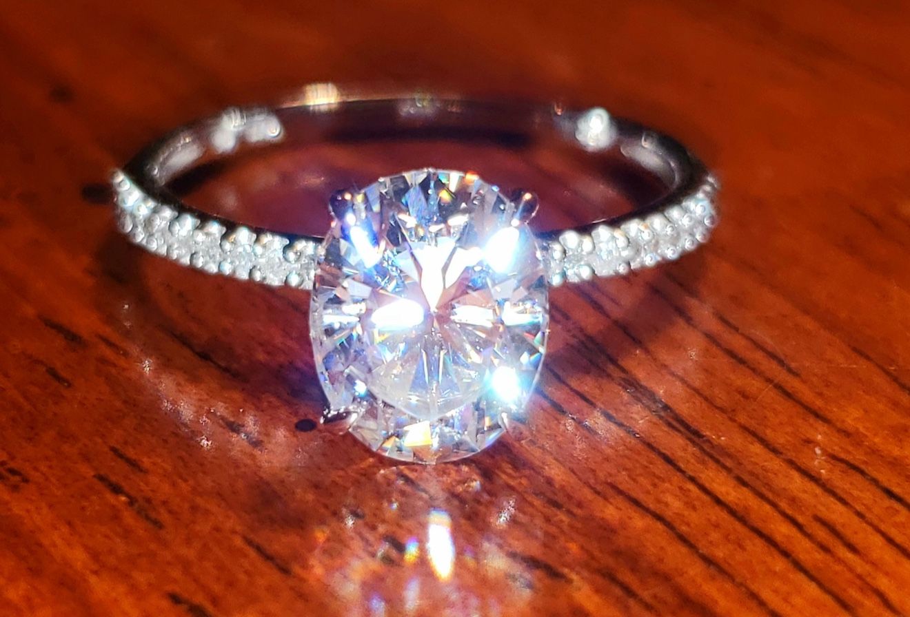 Stella Grace 2 ct. T.W. Oval Cut Lab-Created Moissanite & 1/10 ct. T.W. Diamond Engagement Ring