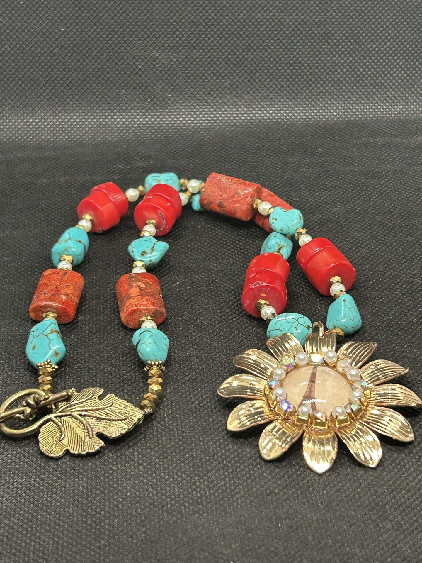 turquoise and red beaded necklace w/ Gold Flower Shaped Eiffel Tower Pendant 