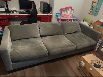 Grey Couch. Comfortable and structurally solid. Smoke-free home. Pickup only.