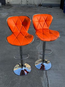 2 Orange & chrome chair bar stools