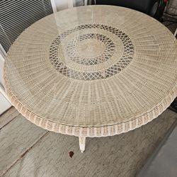 Wicker table with glass