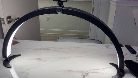 Half moon light with phone holder