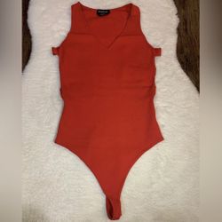 Bebe. Bodysuit. Color orange. Size S/P