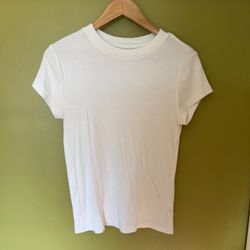 A New Day white tee