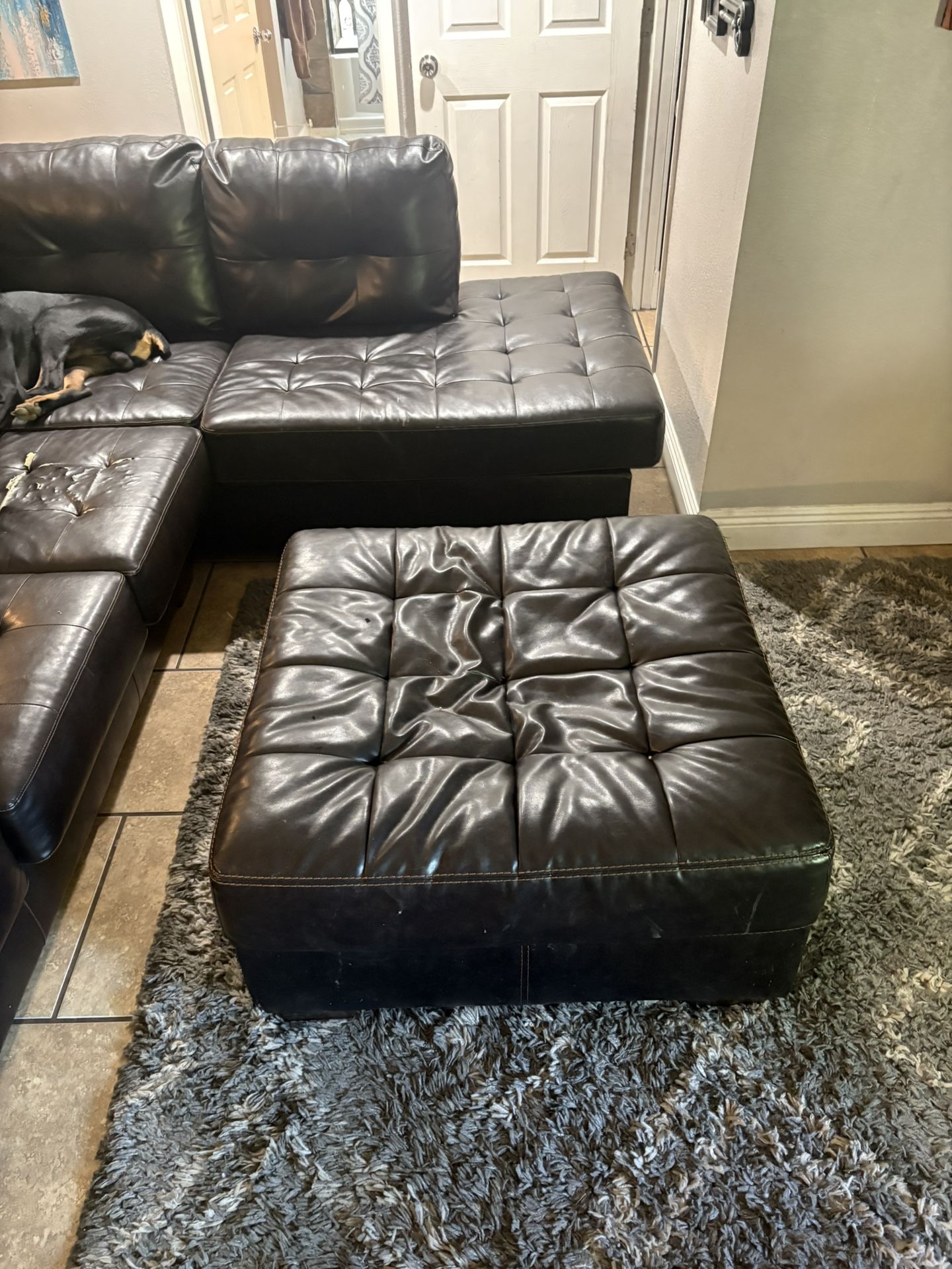 Black Leather Sectional And Ottoman