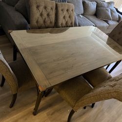 Dining room with six brown chairs, Ashley brand