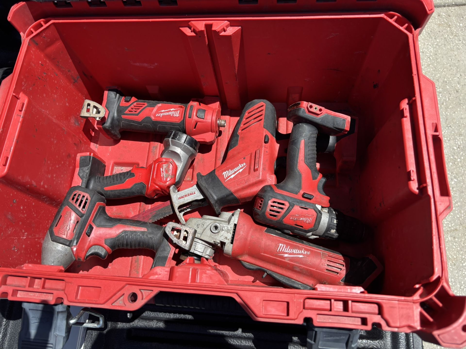 Milwaukee Pack out, Power Tools Drill Driver Sawzall Grinder Batteries, 6 Battery Charger, And Radio