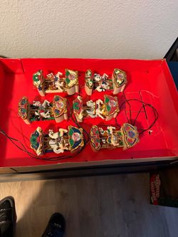 Vintage 1992 https://offerup.com/redirect/?o=TXIuQ2hyaXN0bWFz Holiday Carousel Musical Christmas Ornament Set