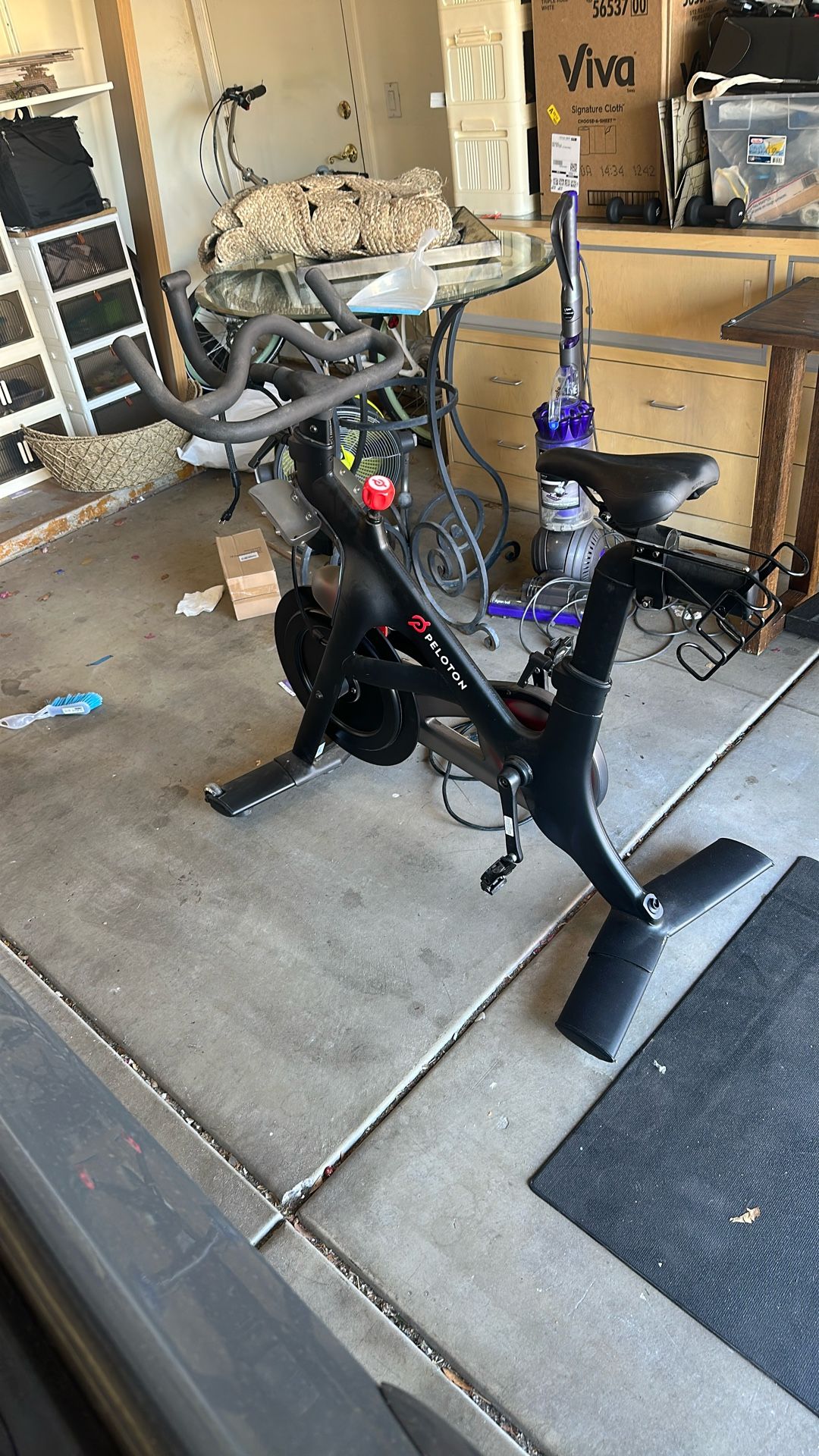 Peleton Bike With Mat Weights And 2 Pairs Of Shoes