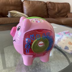 Fisher-Price Baby & Toddler Toy Laugh & Learn Smart Stages Piggy Bank with Educational Songs & Phrases for Infants Ages 6+ Months