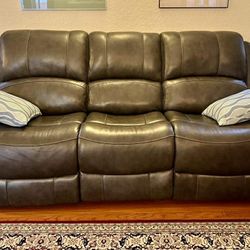 Ashley Furniture's gray leather power reclining sofa and loveseat