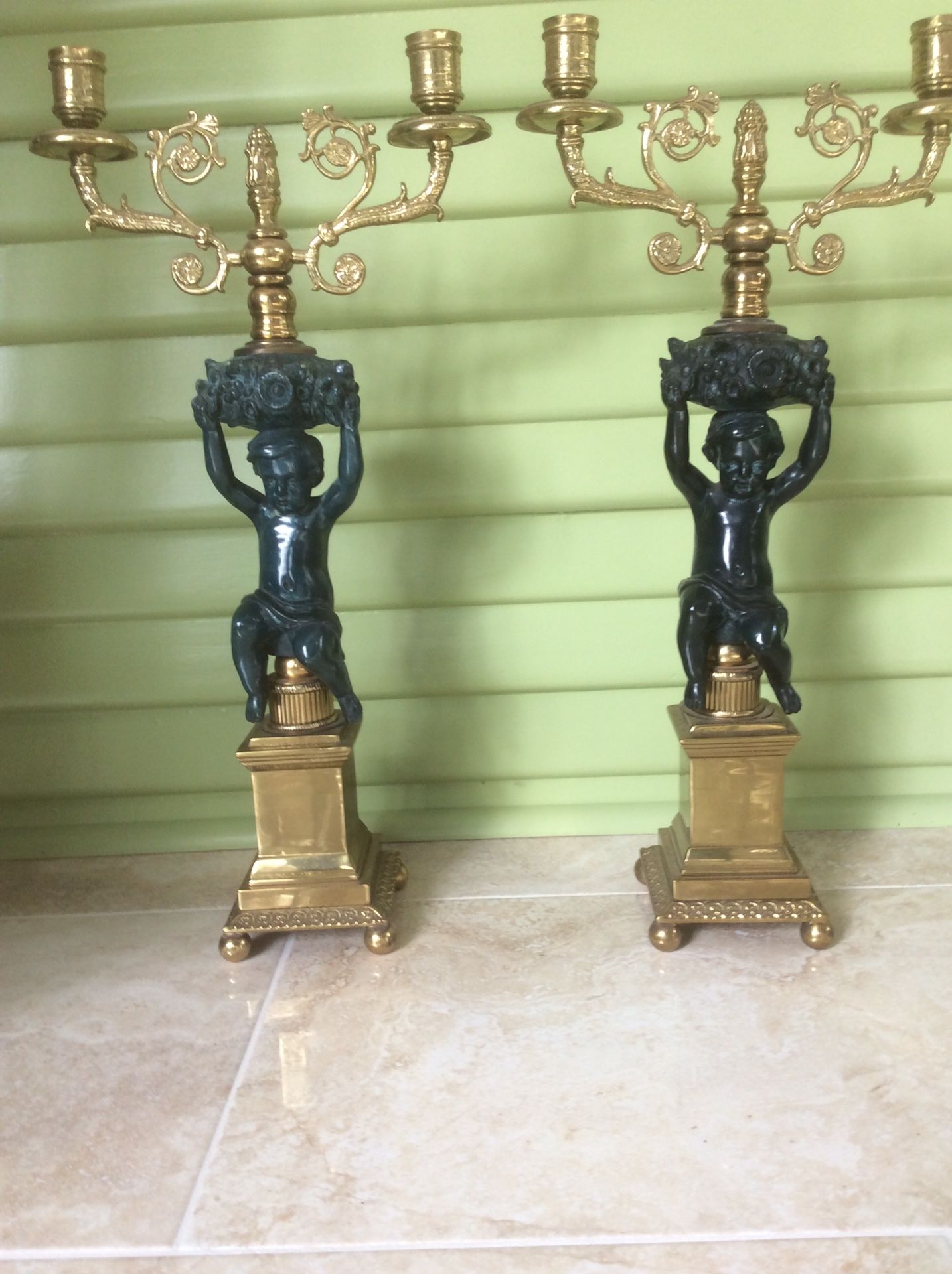 Pair of Brass and stone cherub candelabras