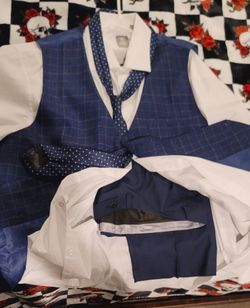 Vest/tie/white collar long sleeve & slacks