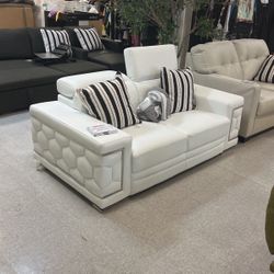 White Leather Loveseat With Adjustable Head Rests. 