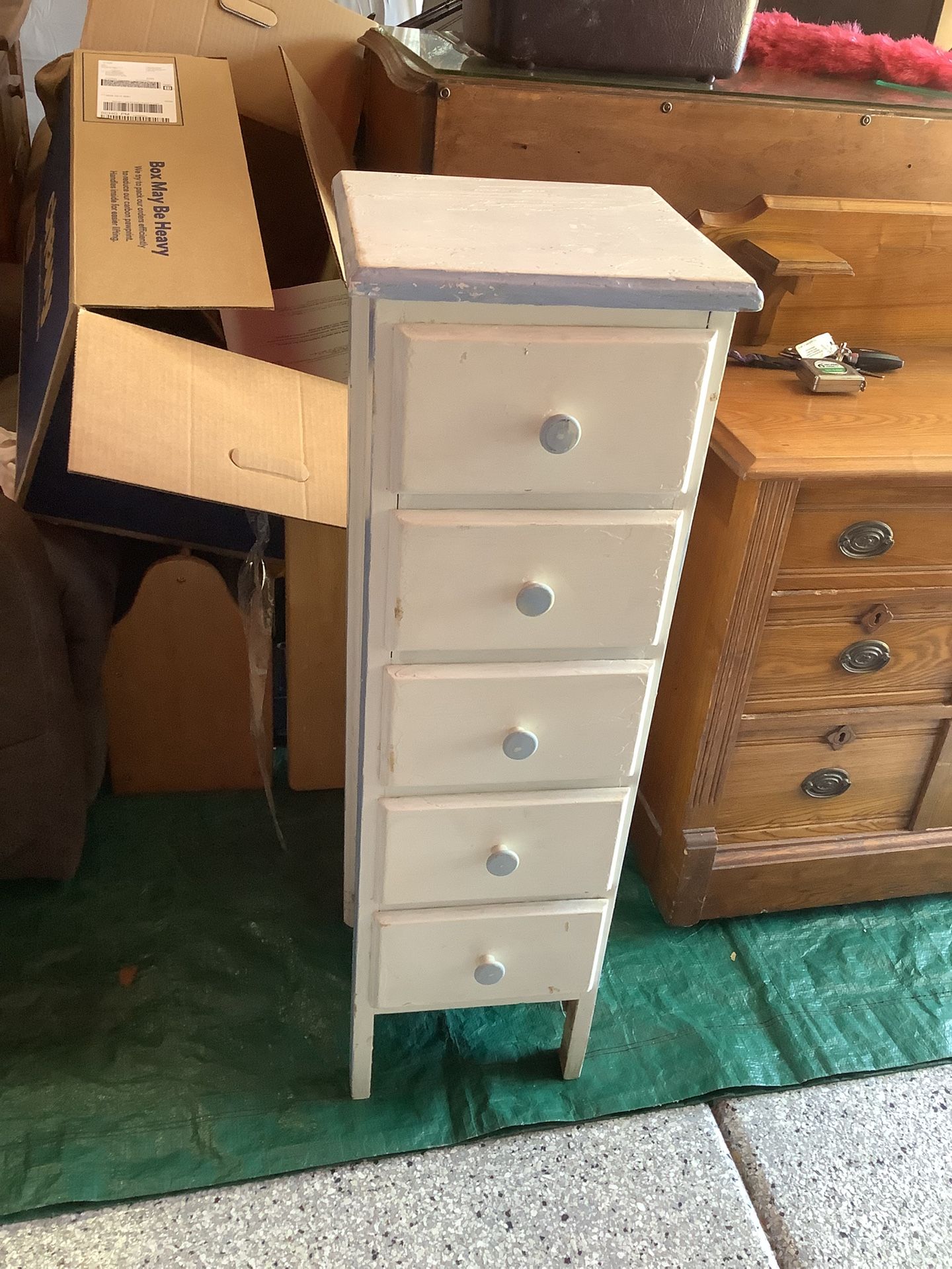 Vintage solid wood skinny cabinet approximately 38” tall and 12” wide and deep All drawers work painted white with light blue trim Plainfield, Illino