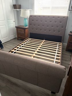 Queen upholstered bed made by Emerald