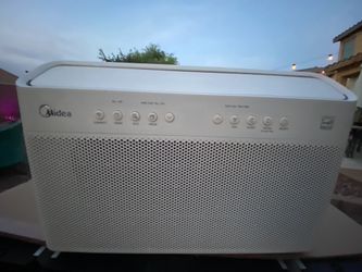 White Midea Air Conditioner/ over the window frame installation