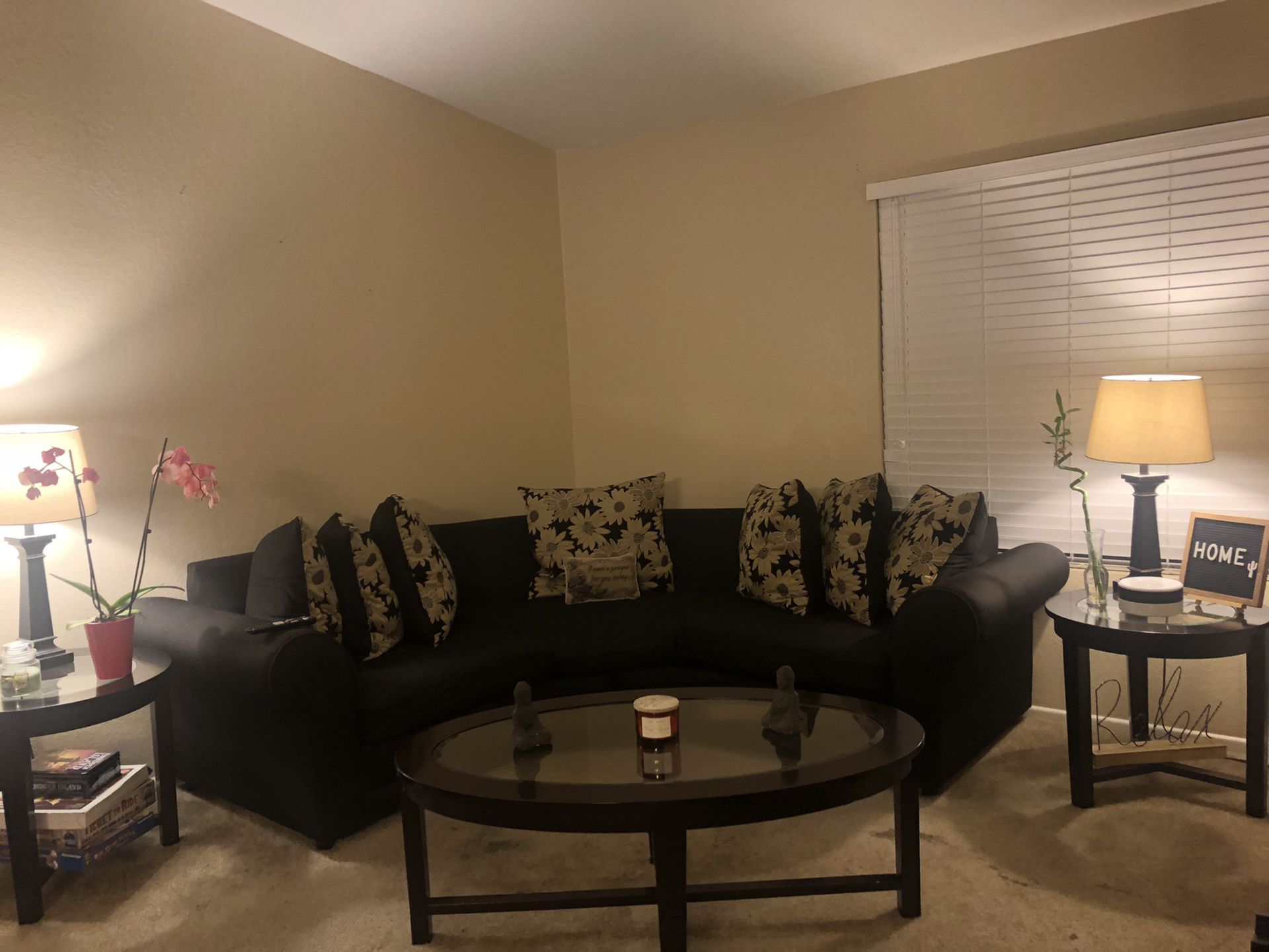 Black Couch with Tables and Lamps